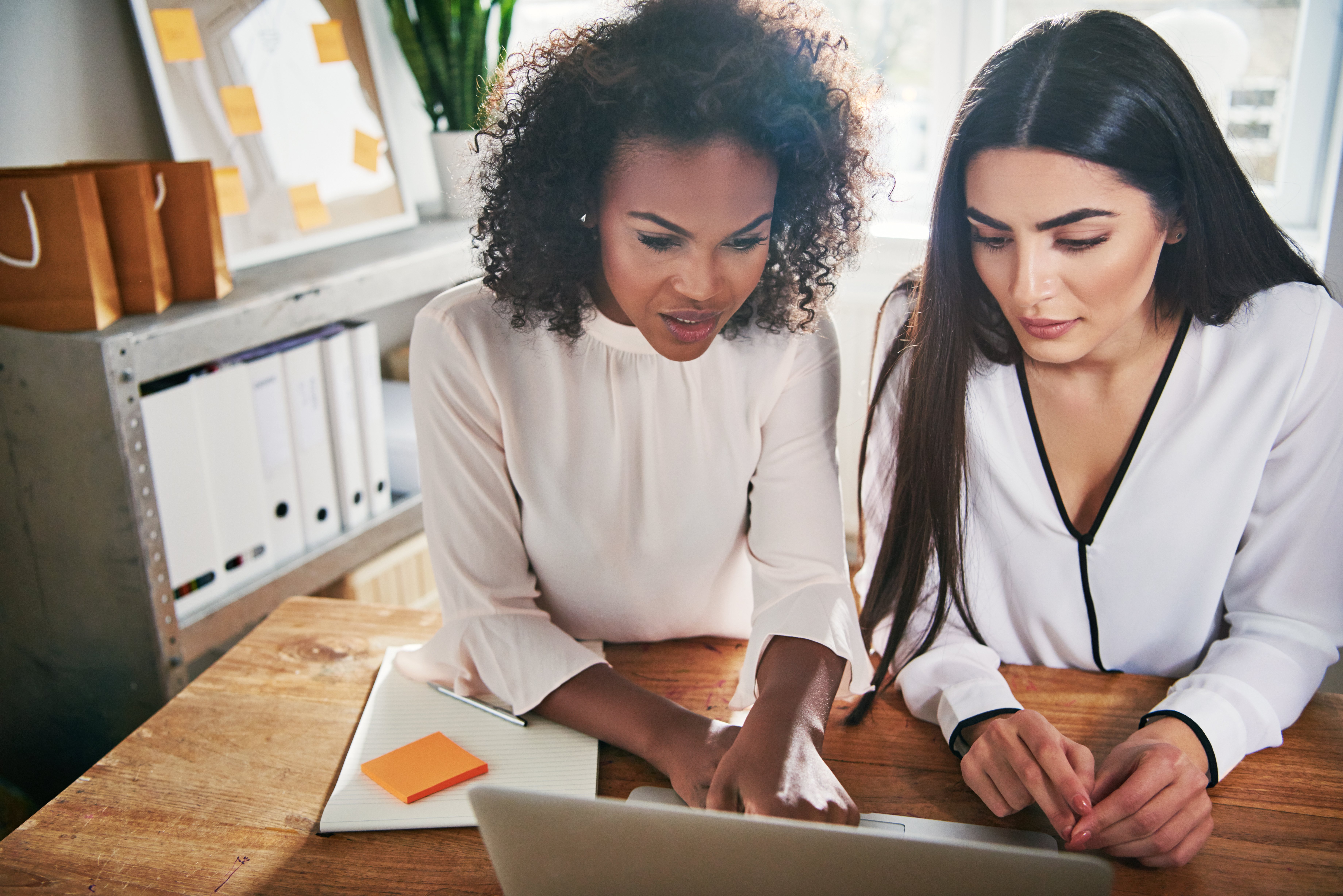 two-hardworking-young-female-entrepreneurs-YS93HDE